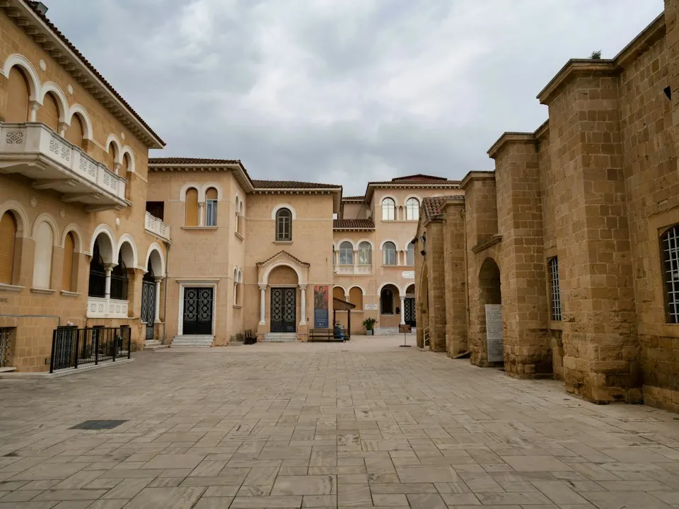 Sandstone buildings around a paved square in Nicosia's old town